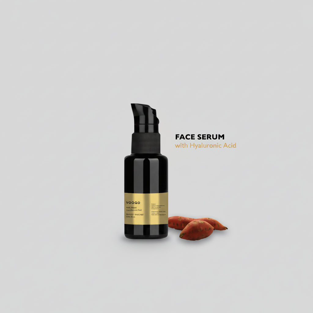 Black face serum bottle with gold label on a light gray background
