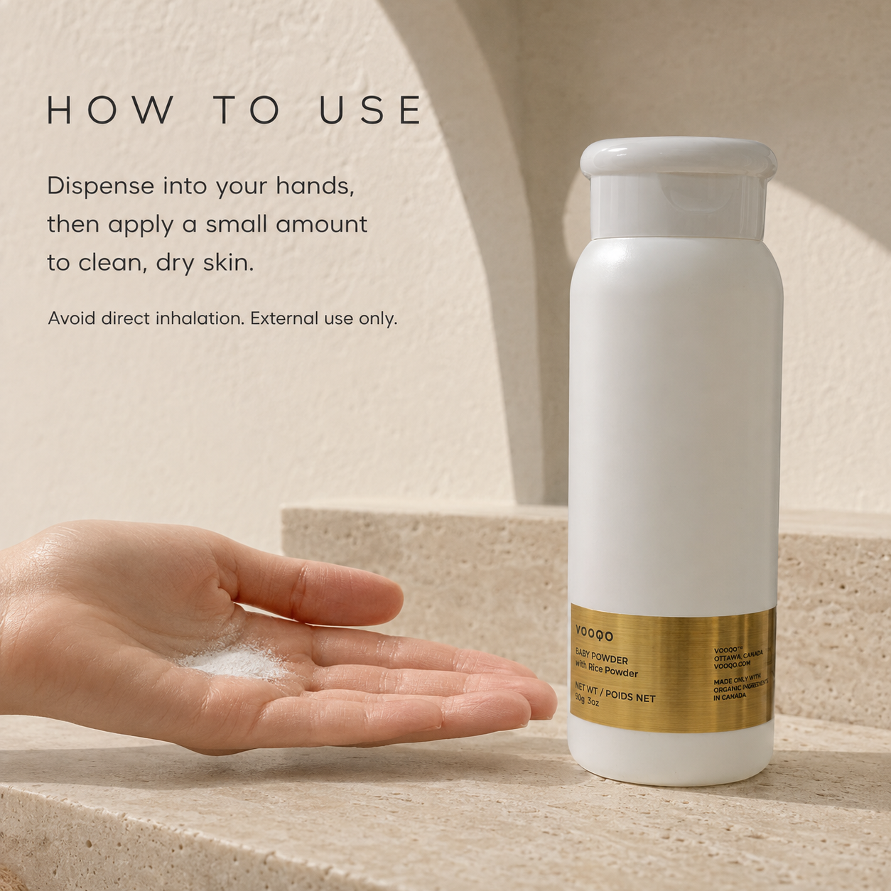 Small amount of Vooqo Baby Powder dispensed into a hand for controlled application