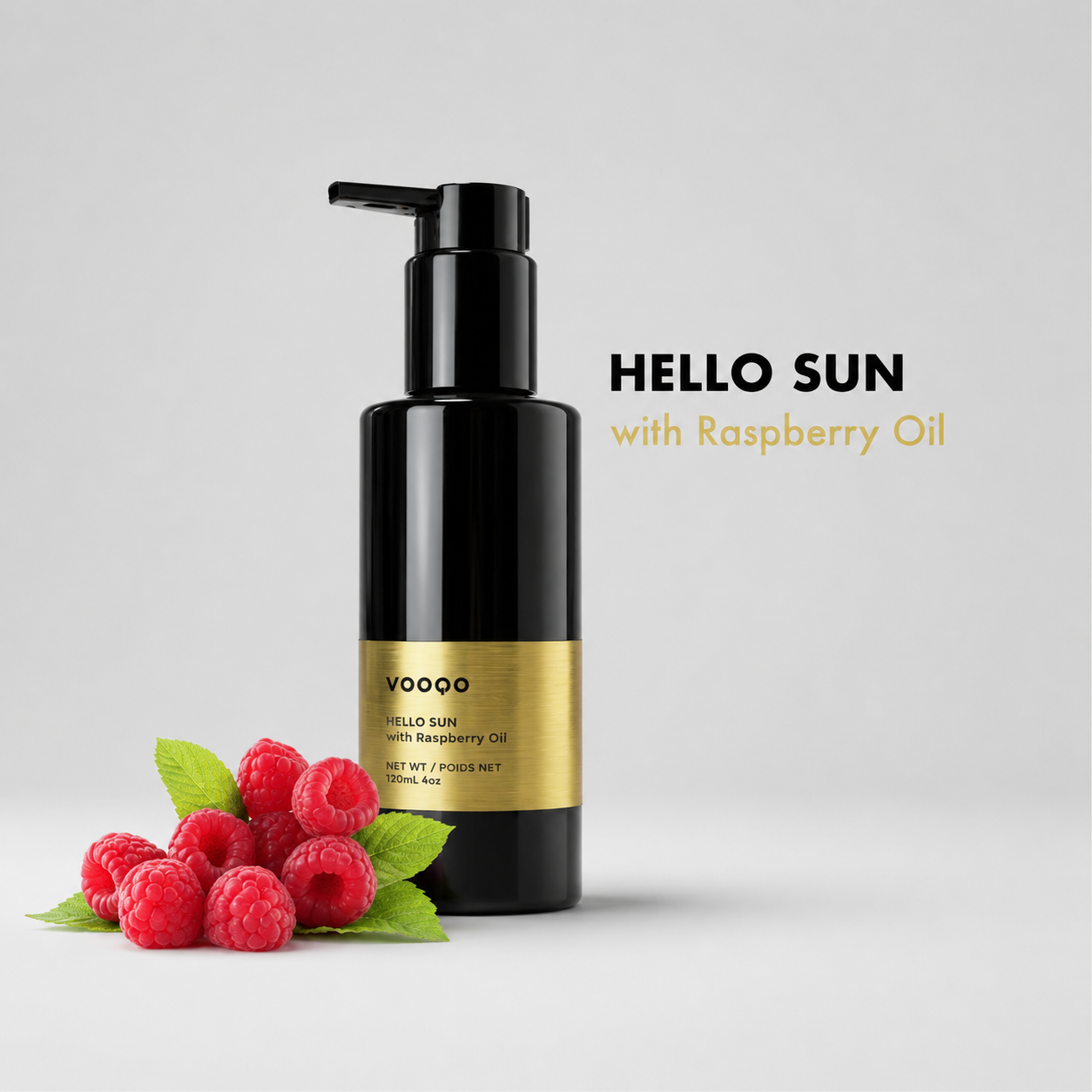 Black bottle labeled 'HELLO SUN with Raspberry Oil' on a light gray background with raspberries.