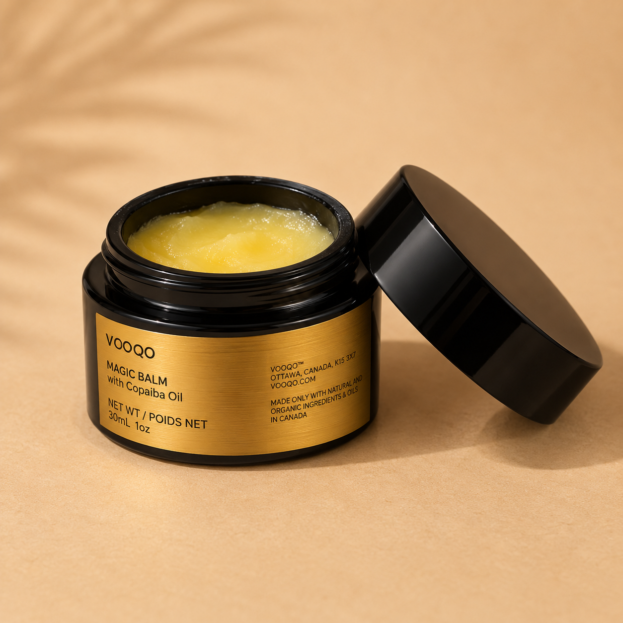 Open jar of Vooqo Magic Balm with Copaiba Oil showing the rich natural balm texture.