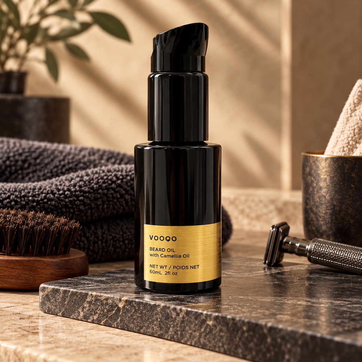 Vooqo Beard Oil with Camellia Oil styled on dark stone with a beard brush, towel, and razor in a warm grooming setting.