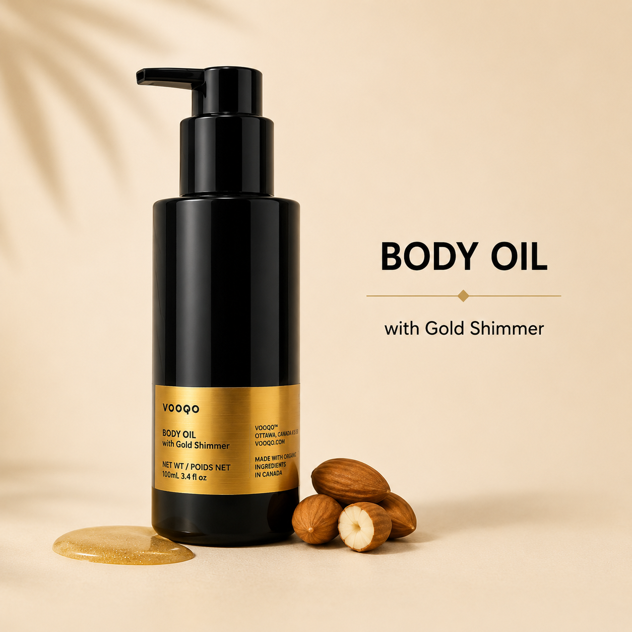 A black pump bottle of VOOGO Body Oil with Gold Shimmer, styled with almonds and a gold shimmer puddle on a beige background with text reading 'BODY OIL with Gold Shimmer'.