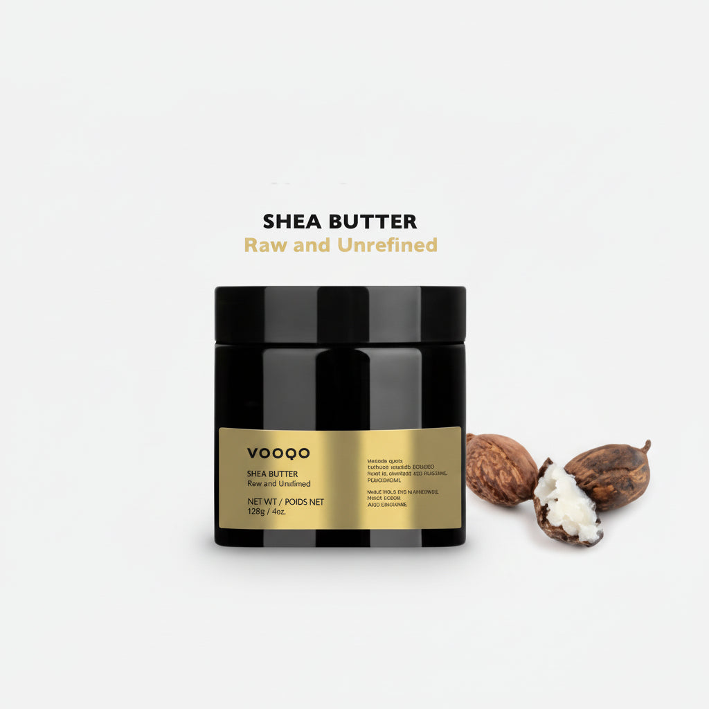 Jar of VOOGO shea butter with shea nuts and a kernel on a white background