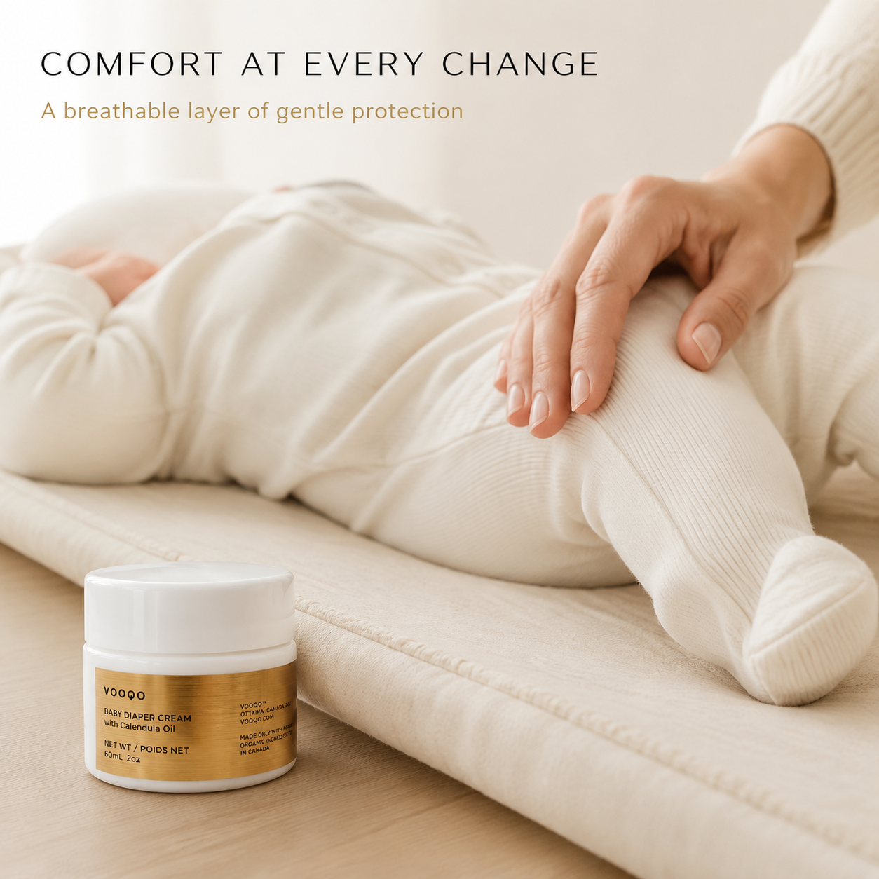 Vooqo Baby Diaper Cream beside a fully clothed baby after a diaper change