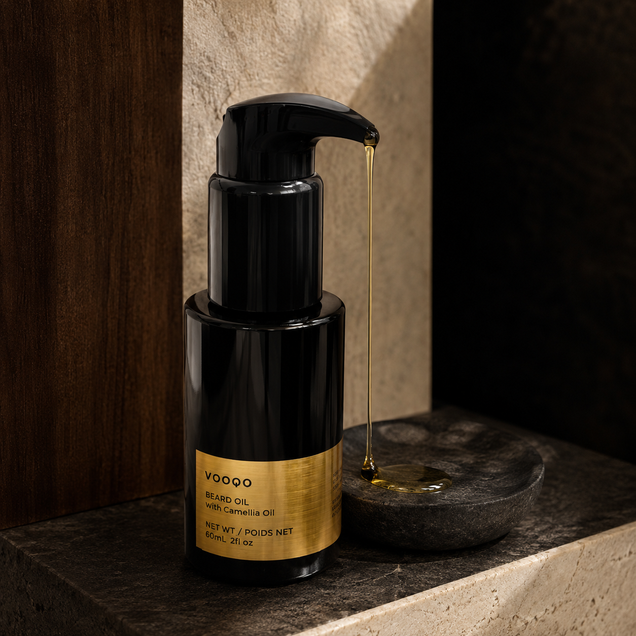 Vooqo Beard Oil dispensing a silky golden oil texture onto dark stone