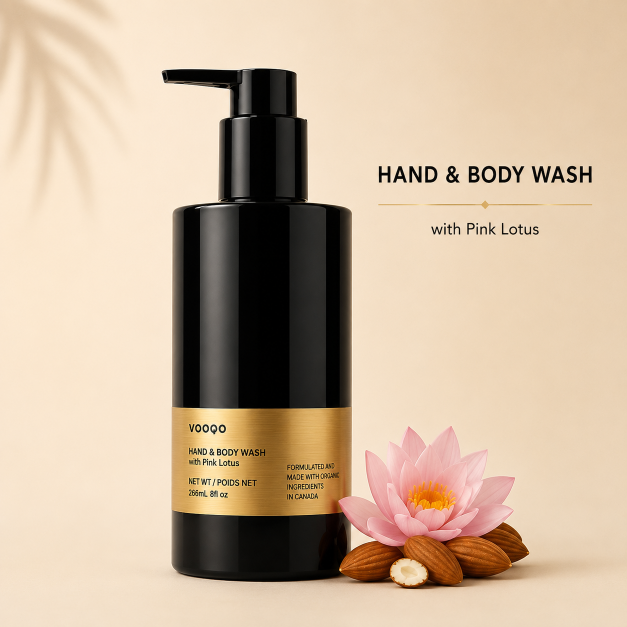 Vooqo Hand & Body Wash with Pink Lotus main product image with black pump bottle, gold label, pink lotus flower, and warm neutral background.
