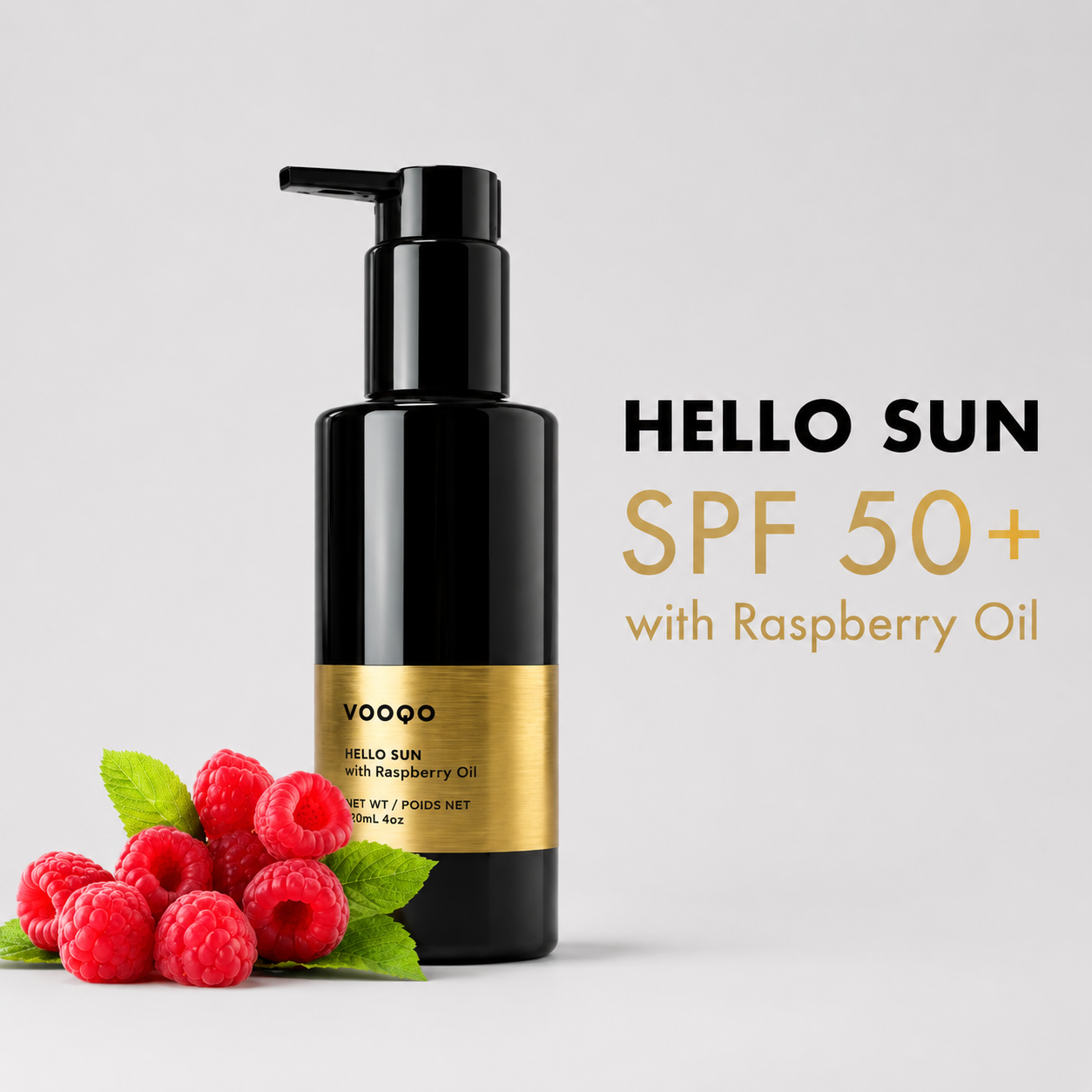 Vooqo Hello Sun SPF 50+ with Raspberry Extract main product image with black pump bottle and raspberries.