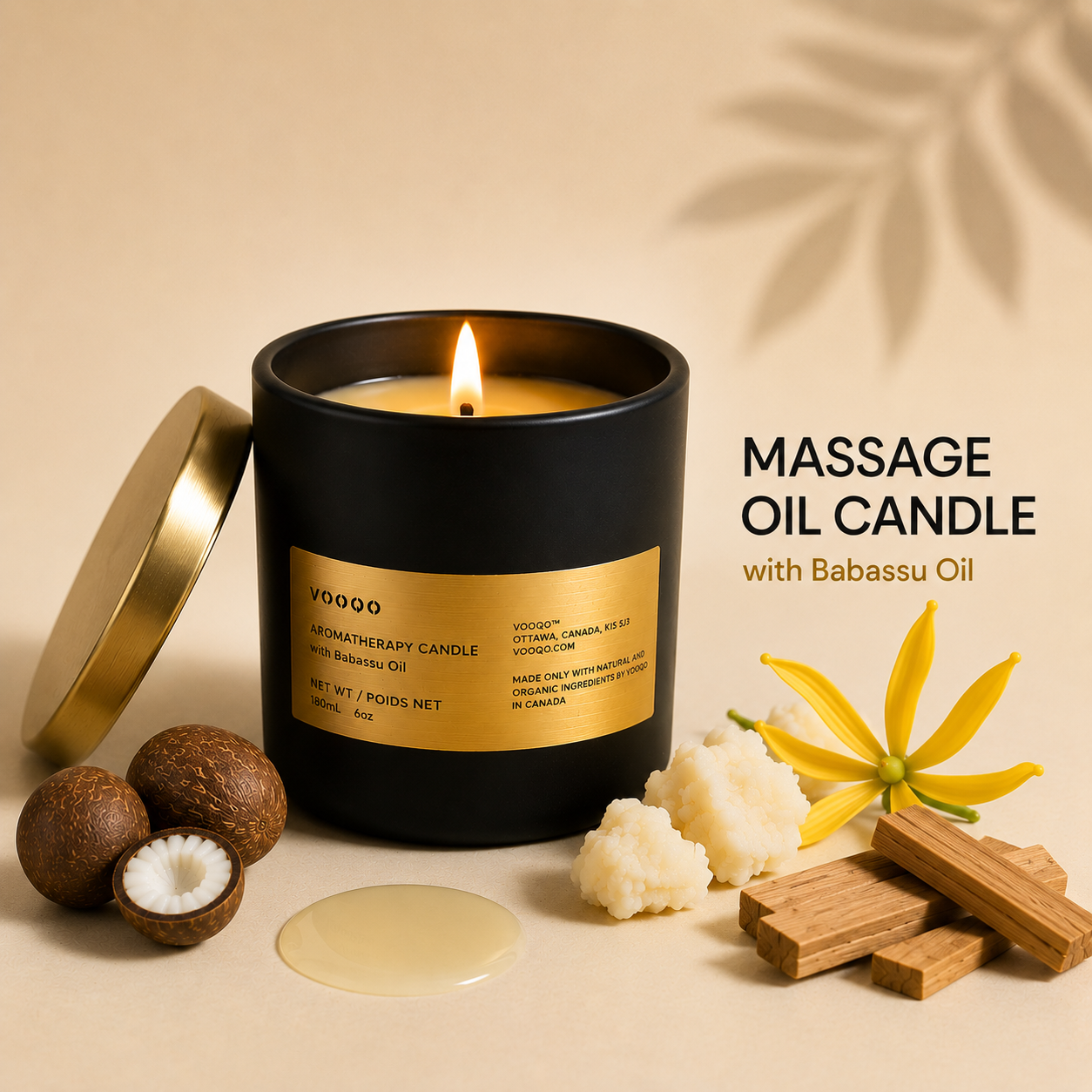 Vooqo Massage Oil Candle with Babassu Oil in matte black packaging with a gold lid and botanical ingredients.